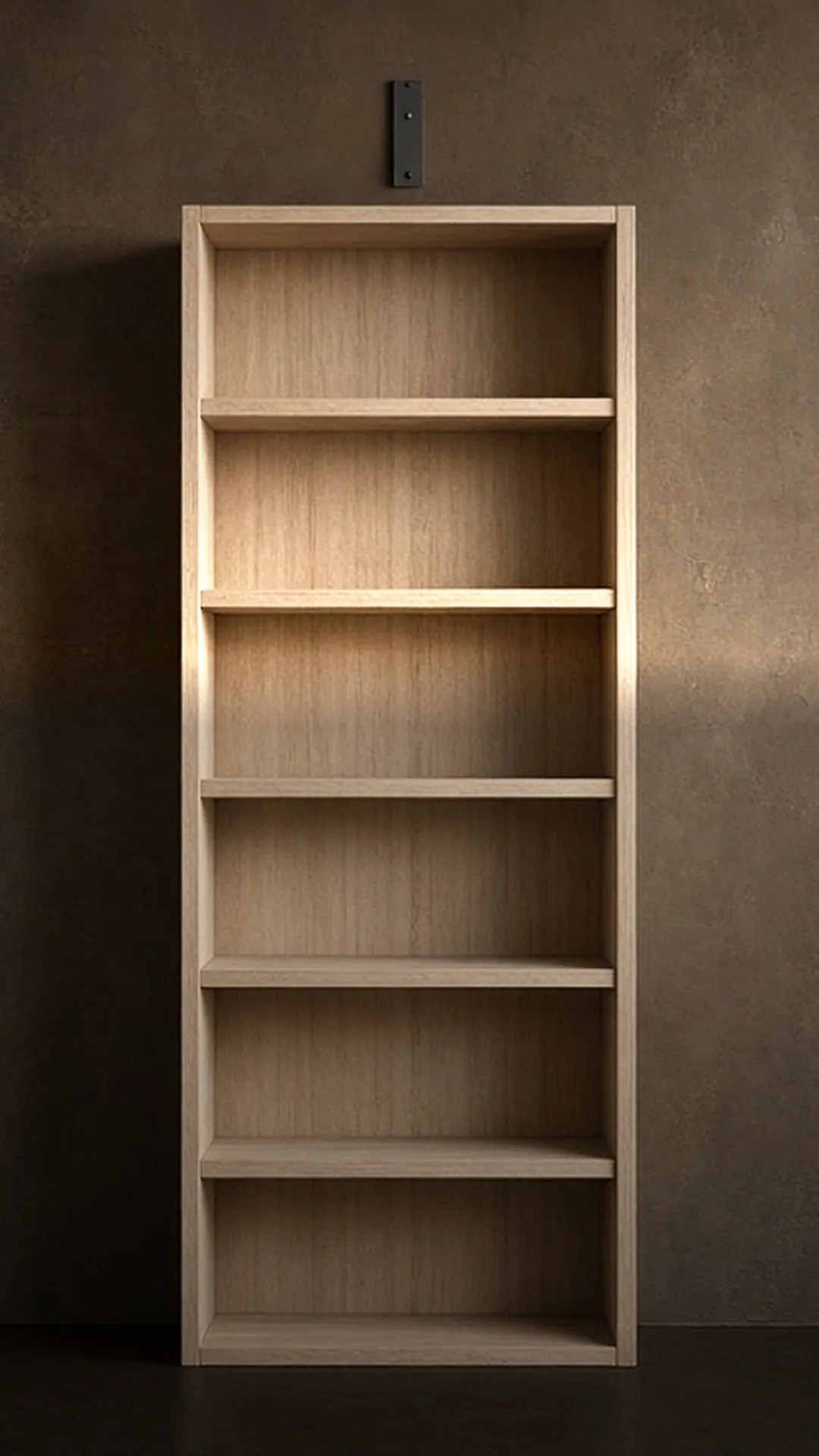 A tall empty bare wood bookcase against a warm brown wall with a bracket fitted above