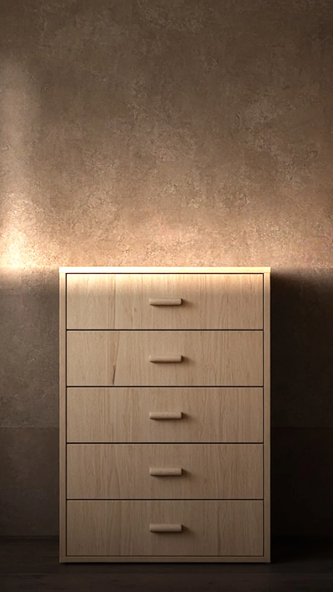 A bare wood chest of five closed drawers standing flat against a warm brown wall